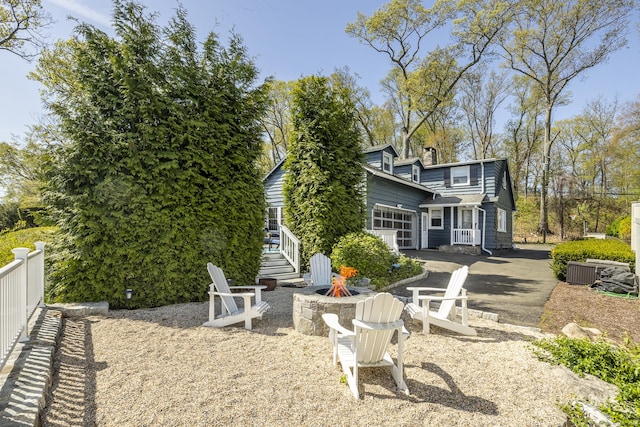 29 Old Neversink Rd, Danbury, CT 06811 - exterior space featuring fence, driveway, and an outdoor fire pit