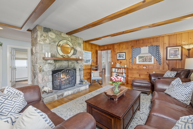 29 Old Neversink Rd, Danbury, CT 06811 - living area featuring wooden walls, a fireplace, wood finished floors, a baseboard radiator, and beamed ceiling