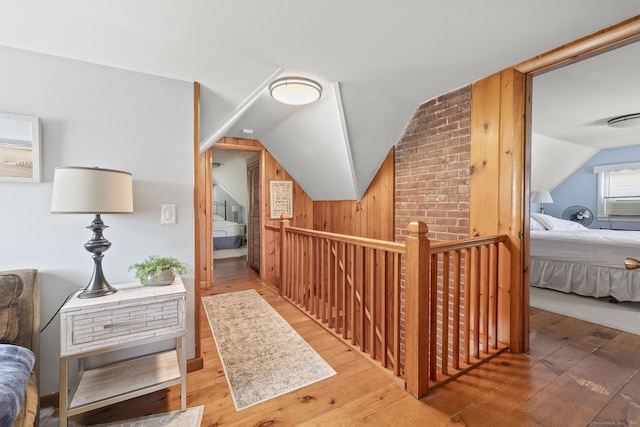 29 Old Neversink Rd, Danbury, CT 06811 - interior space with wood-type flooring, wooden walls, vaulted ceiling, and an upstairs landing