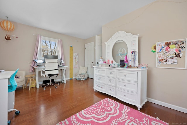 bedroom featuring dark wood-type flooring and baseboards