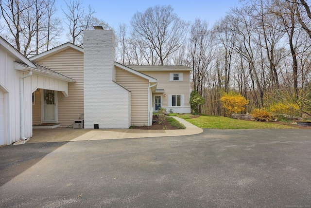 view of front of property featuring a chimney