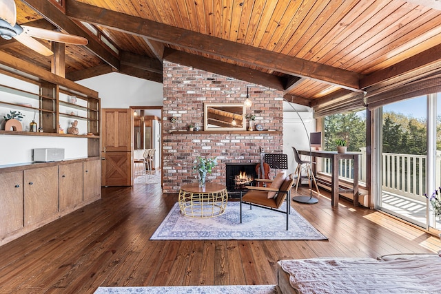 living room featuring wood-type flooring, wood ceiling, a brick fireplace, and vaulted ceiling with beams