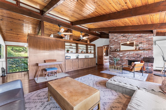 living room with a fireplace, wood-type flooring, a ceiling fan, vaulted ceiling with beams, and a baseboard heating unit