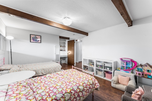 bedroom featuring a textured ceiling, beam ceiling, and wood finished floors