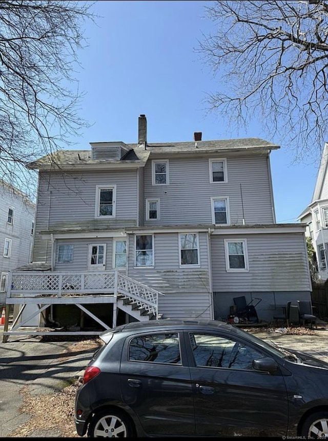 rear view of house with a chimney