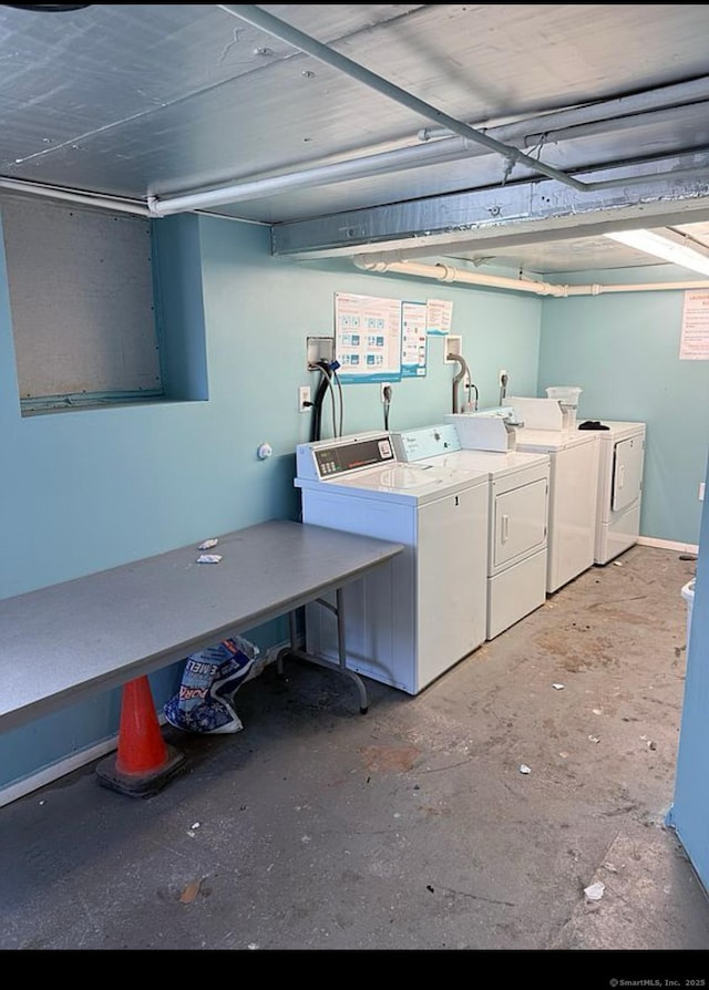 community laundry room with separate washer and dryer