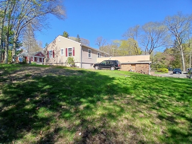 297 Whittemore Rd, Middlebury, CT 06762 - view of side of home with a yard
