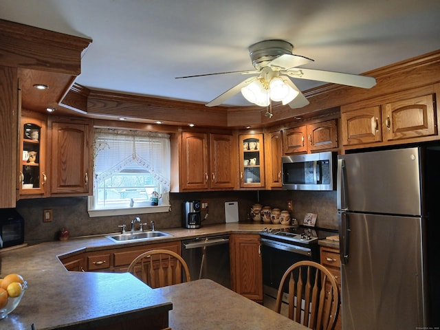297 Whittemore Rd, Middlebury, CT 06762 - kitchen with stainless steel appliances, a sink, brown cabinetry, and tasteful backsplash