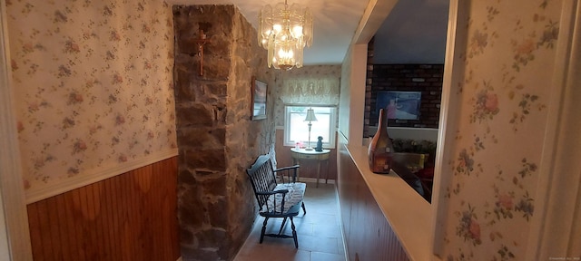 297 Whittemore Rd, Middlebury, CT 06762 - corridor with a wainscoted wall, a chandelier, wallpapered walls, and wood walls