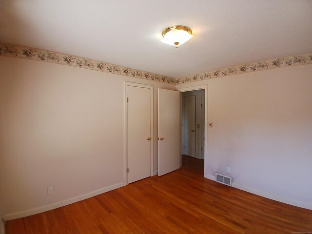 297 Whittemore Rd, Middlebury, CT 06762 - unfurnished room with wood finished floors and baseboards