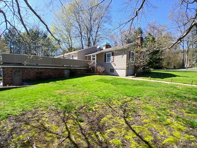 297 Whittemore Rd, Middlebury, CT 06762 - view of side of property with a yard, a chimney, and a deck