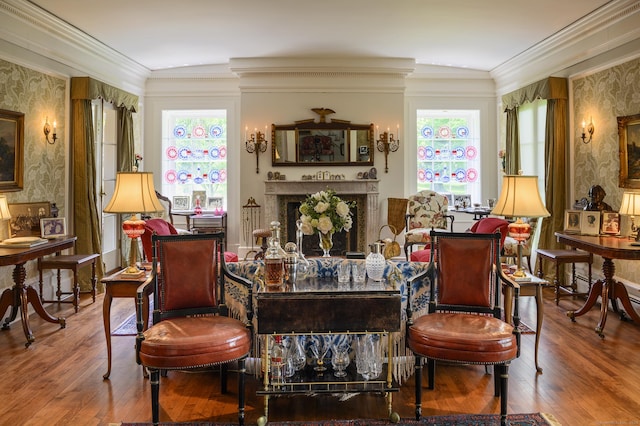 living area with wallpapered walls, a wealth of natural light, and a fireplace