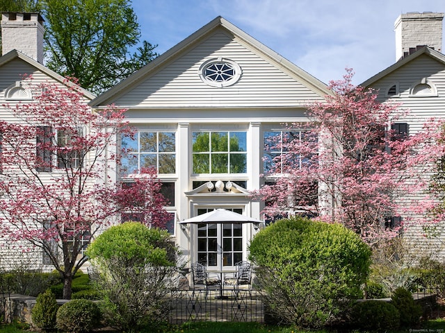 back of house featuring french doors