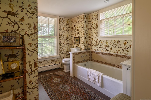full bathroom featuring toilet, a baseboard heating unit, vanity, a garden tub, and wallpapered walls