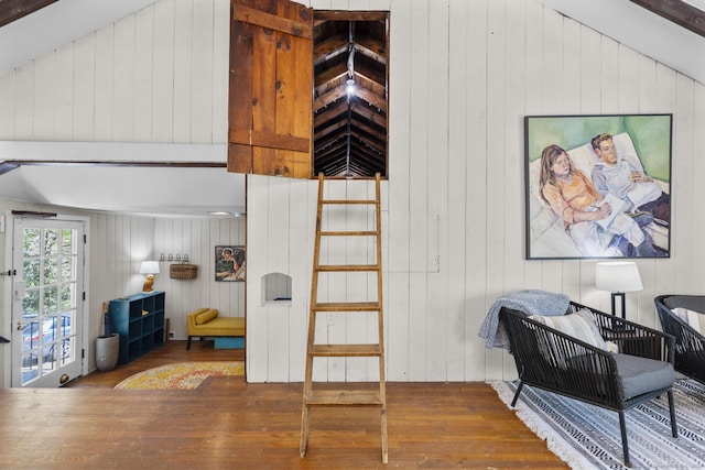 interior space featuring wooden walls and hardwood / wood-style flooring