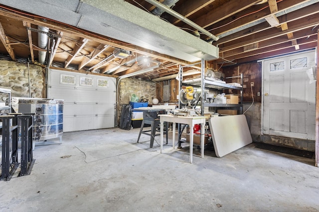unfinished below grade area featuring a workshop area