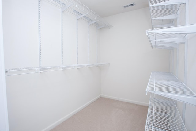 walk in closet with carpet flooring and visible vents