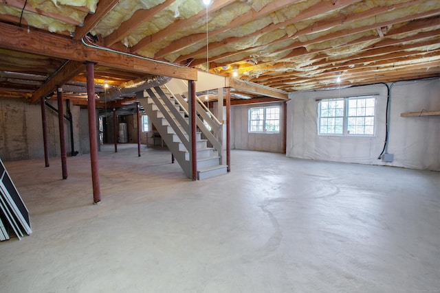 basement with stairs and water heater