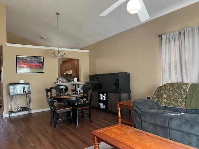 dining space featuring dark wood-type flooring, a ceiling fan, baseboards, and lofted ceiling