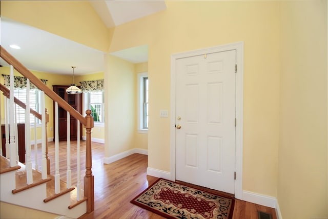 5 Marjories Way Unit 5, East Lyme, CT 06357 - entrance foyer featuring stairway, wood finished floors, baseboards, and vaulted ceiling