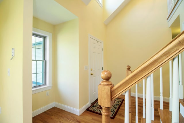 5 Marjories Way Unit 5, East Lyme, CT 06357 - entrance foyer featuring wood finished floors, plenty of natural light, baseboards, and stairway