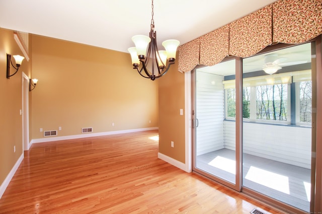 5 Marjories Way Unit 5, East Lyme, CT 06357 - empty room with light wood-style floors, baseboards, a chandelier, and a ceiling fan
