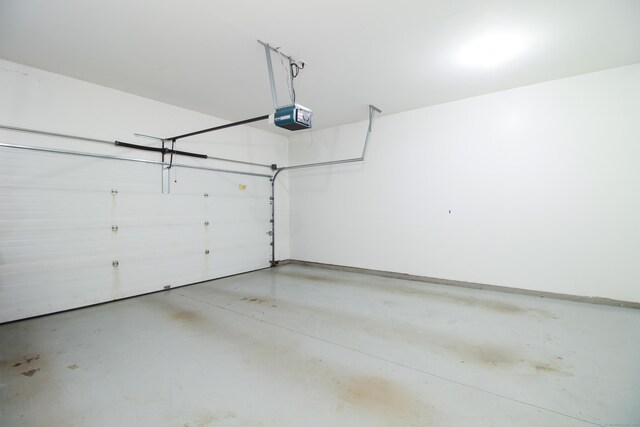 5 Marjories Way Unit 5, East Lyme, CT 06357 - garage featuring a garage door opener