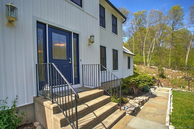 entrance to property featuring board and batten siding