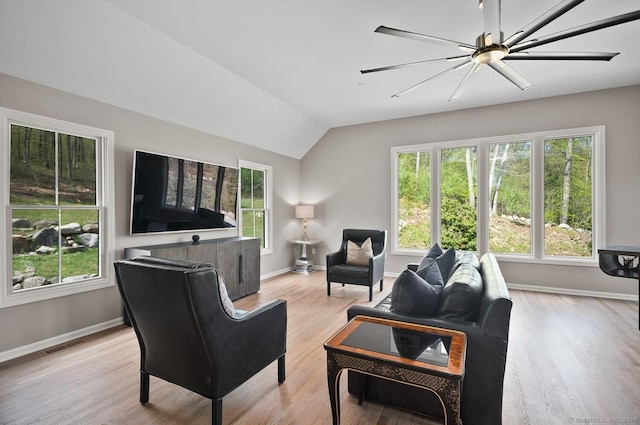living room featuring baseboards and plenty of natural light