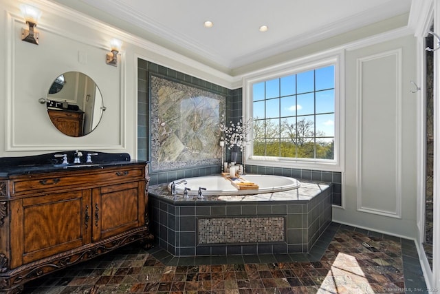 full bathroom featuring vanity, ornamental molding, a garden tub, and recessed lighting