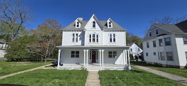 221 Broadway, Norwich, CT 06360 - view of front of property featuring a porch, a front lawn, and a chimney