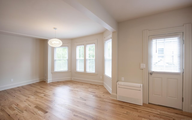 221 Broadway, Norwich, CT 06360 - interior space with baseboards, a notable chandelier, and light wood-type flooring