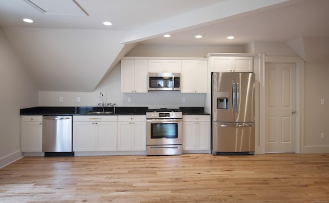 221 Broadway, Norwich, CT 06360 - kitchen featuring white cabinets, appliances with stainless steel finishes, a sink, light wood-style flooring, and recessed lighting