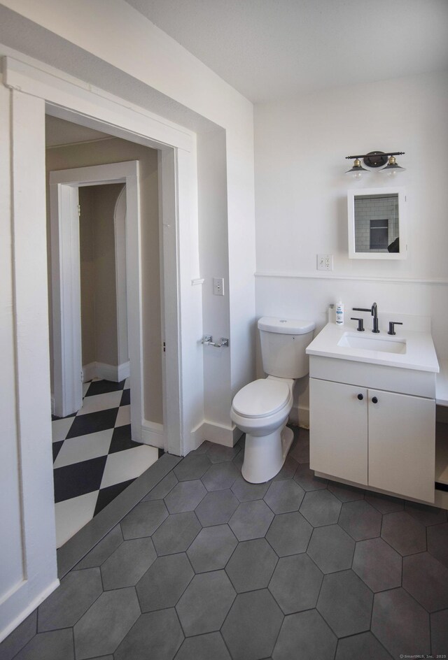 221 Broadway, Norwich, CT 06360 - bathroom with vanity, tile patterned floors, and toilet