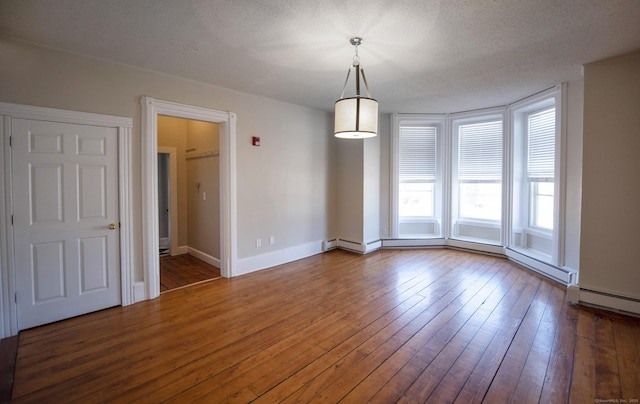 221 Broadway, Norwich, CT 06360 - unfurnished dining area featuring baseboards and hardwood / wood-style flooring