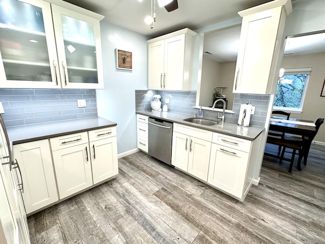 103D Wendover Dr Unit D, Monroe, CT 06468 - kitchen with dishwasher, a sink, light wood-style floors, glass insert cabinets, and backsplash