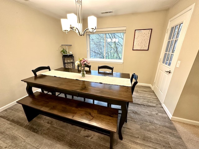 103D Wendover Dr Unit D, Monroe, CT 06468 - dining area with baseboards, a chandelier, and wood finished floors