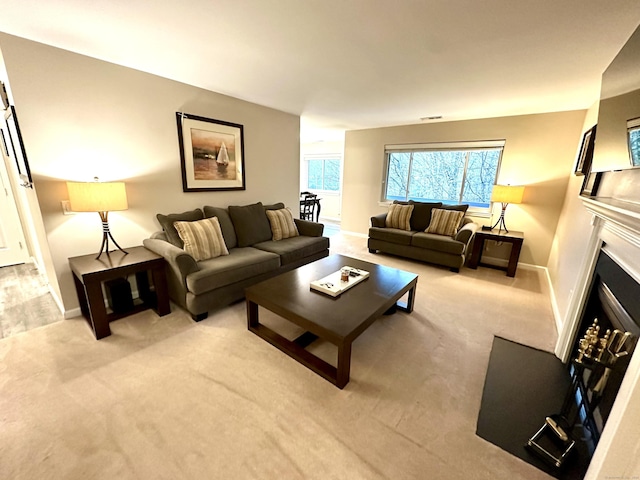 103D Wendover Dr Unit D, Monroe, CT 06468 - living area with baseboards, light carpet, and a fireplace with flush hearth