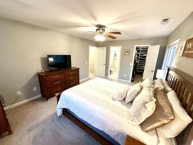 103D Wendover Dr Unit D, Monroe, CT 06468 - bedroom featuring a walk in closet, baseboards, light colored carpet, a ceiling fan, and a closet