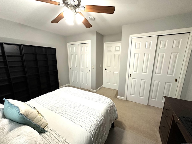 103D Wendover Dr Unit D, Monroe, CT 06468 - bedroom with two closets, light colored carpet, baseboards, and a ceiling fan