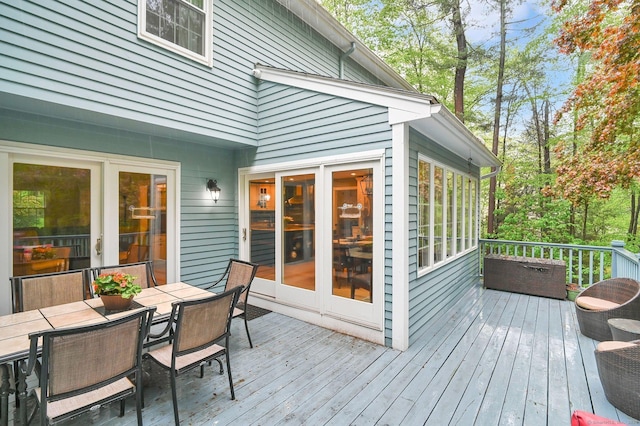 deck with outdoor dining area