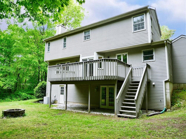 171 Charles Ln, Hebron, CT 06248 - back of house featuring an outdoor fire pit, a wooden deck, french doors, a yard, and a chimney