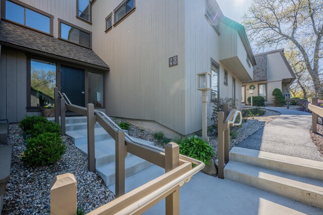 exterior space with a shingled roof