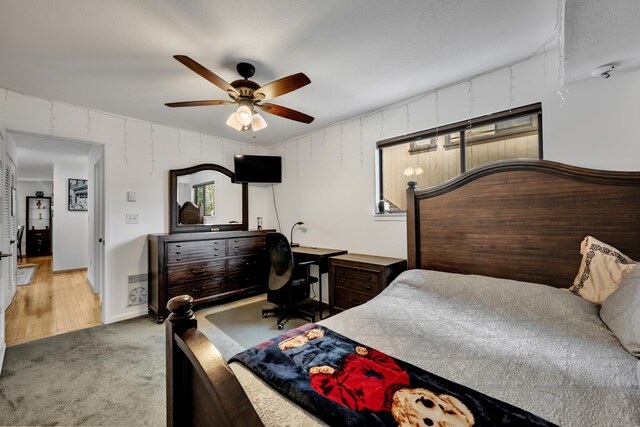 bedroom with ceiling fan and carpet