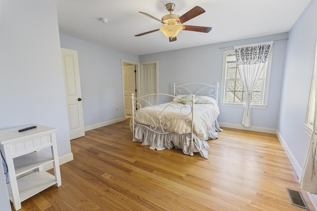 267 Chase Rd, Thompson, CT 06277 - bedroom with light wood-style flooring, baseboards, and ceiling fan