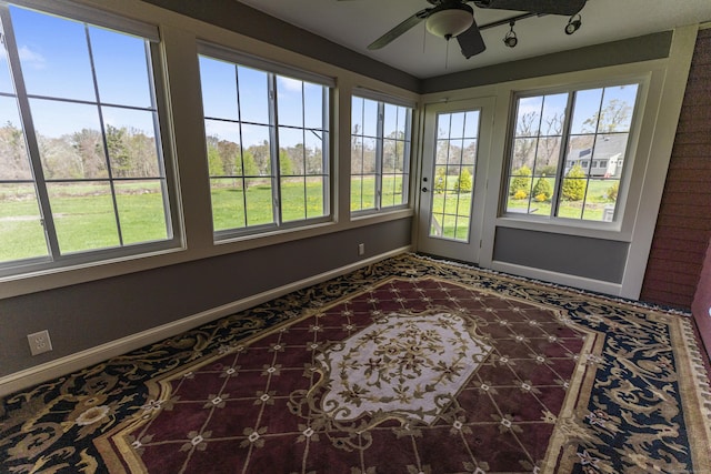 sunroom featuring baseboards