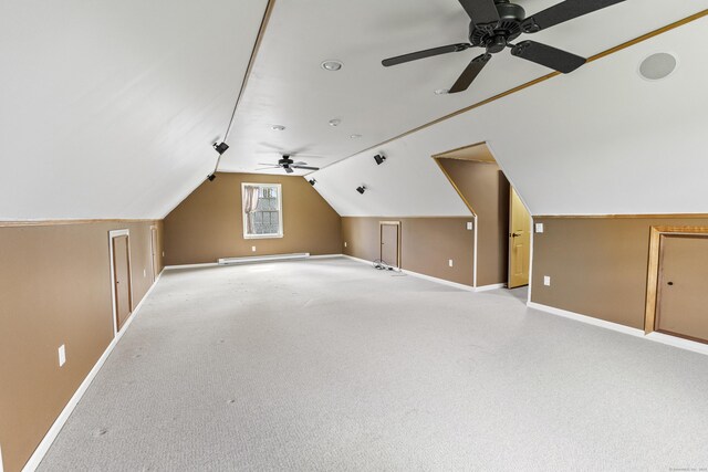267 Chase Rd, Thompson, CT 06277 - additional living space featuring a ceiling fan, baseboards, vaulted ceiling, a baseboard radiator, and light colored carpet