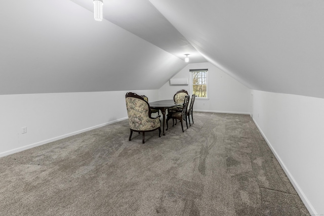 interior space featuring baseboards and vaulted ceiling