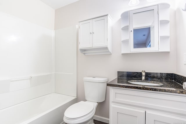 bathroom featuring toilet and vanity