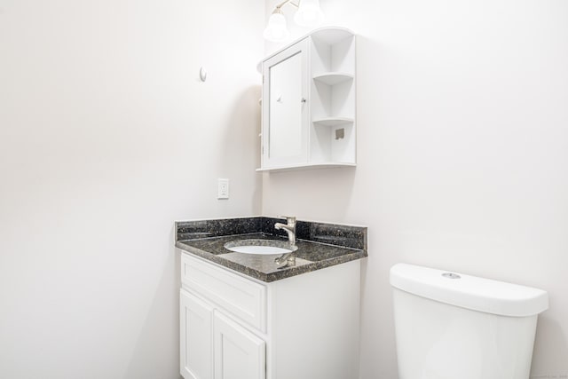 half bath with toilet and vanity